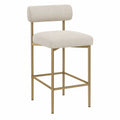Taburete de metal con respaldo de tejido beige y patas doradas